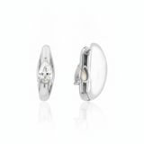 white gold pear spark huggie earrings on white background