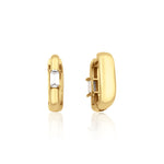 yellow gold baguette huggie earrings on white background