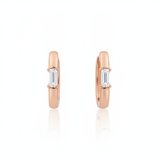 rose gold baguette huggie earrings on white background