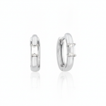 white gold baguette huggie earrings on white background