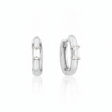 white gold baguette huggie earrings on white background