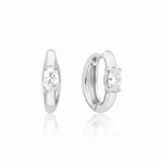 white gold oval stone huggie earrings on white background