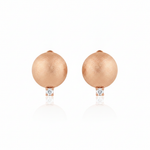 rose gold brushed disc huggie hoop earrings with a single clear stone on white background