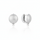 white gold brushed disc huggie hoop earrings with a single clear stone on white background