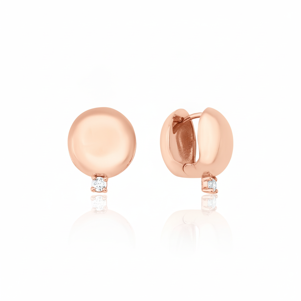 rose gold polished dome huggie hoop earrings with a single clear stone on white background