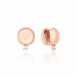 rose gold polished dome huggie hoop earrings with a single clear stone on white background
