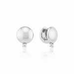 white gold polished dome huggie hoop earrings with a single clear stone on white background