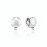 white gold polished dome huggie hoop earrings with a single clear stone on white background
