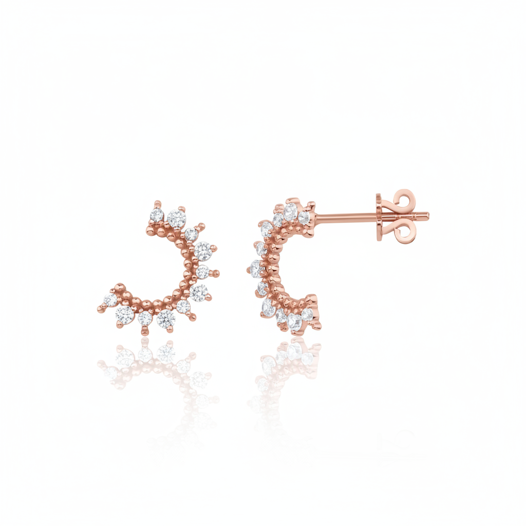 rose gold crescent stud earrings with clear stones on white background