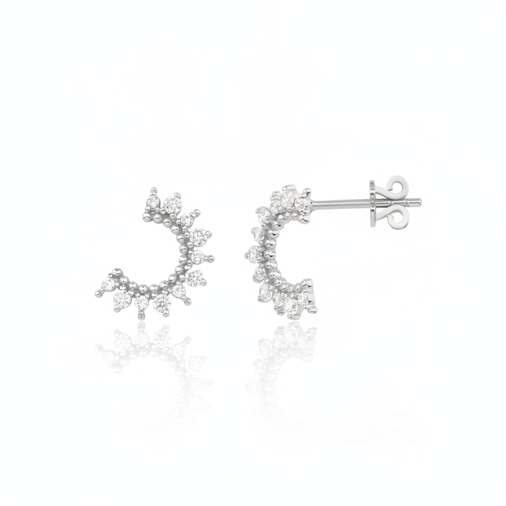 white gold crescent stud earrings with clear stones on white background