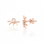 rose gold sunburst stud earrings with a bezel-set clear stone on white background