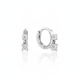 white gold huggie hoop earrings with two cascading clear stones on white background