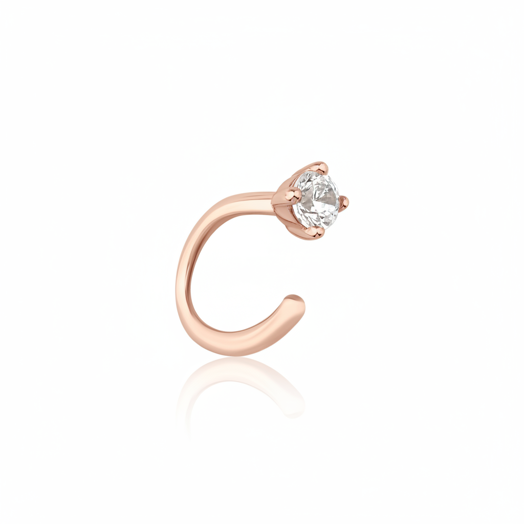 rose gold open curve stud earrings with a single clear stone on white background