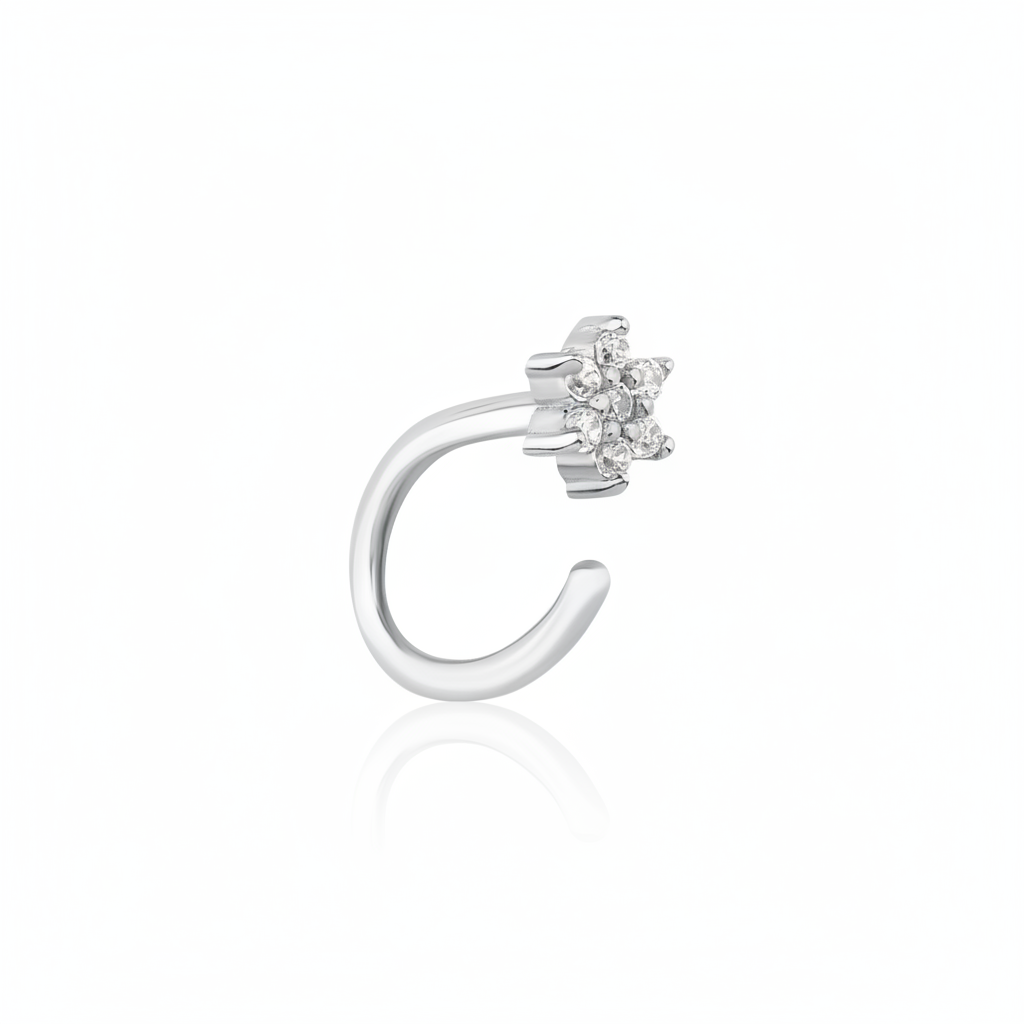 white gold open hoop earring with a floral cluster of clear stones on white background