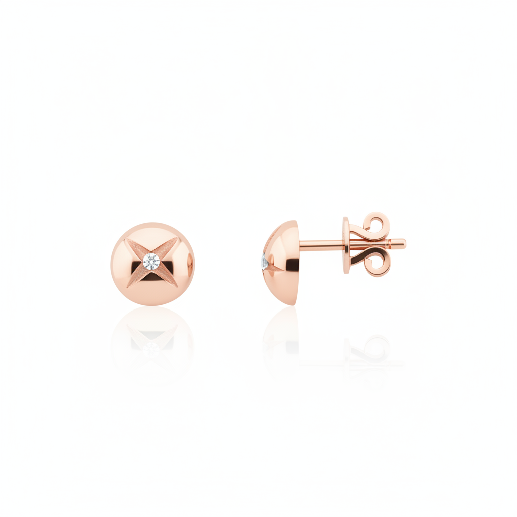 rose gold star-etched dome stud earrings with a single clear stone on white background
