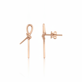 rose gold knot stud earrings with linear drops on white background