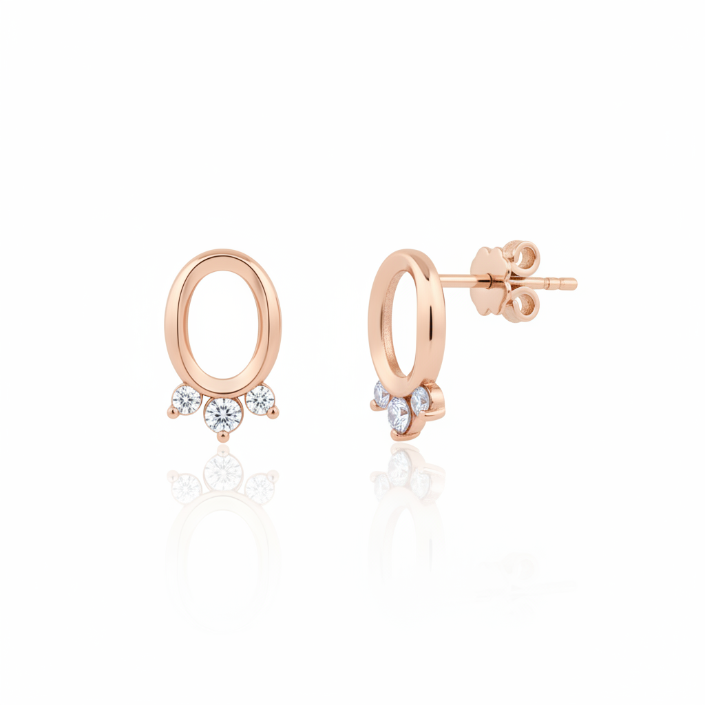 rose gold open oval stud earrings with three clear stones on white background