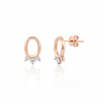 rose gold open oval stud earrings with three clear stones on white background