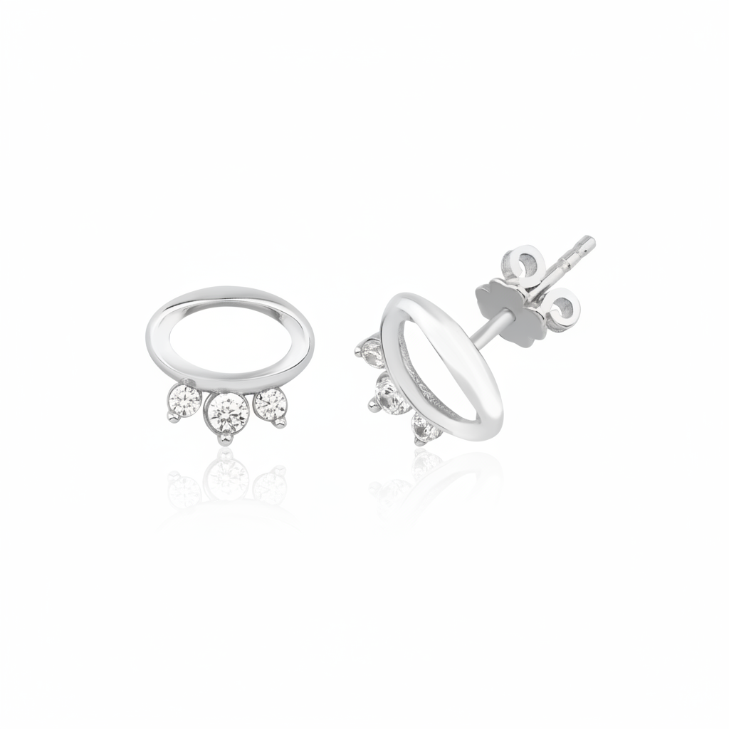 white gold open oval stud earrings with three clear stones on white background
