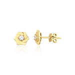 yellow gold pinwheel petal stud earrings with a single clear stone on white background