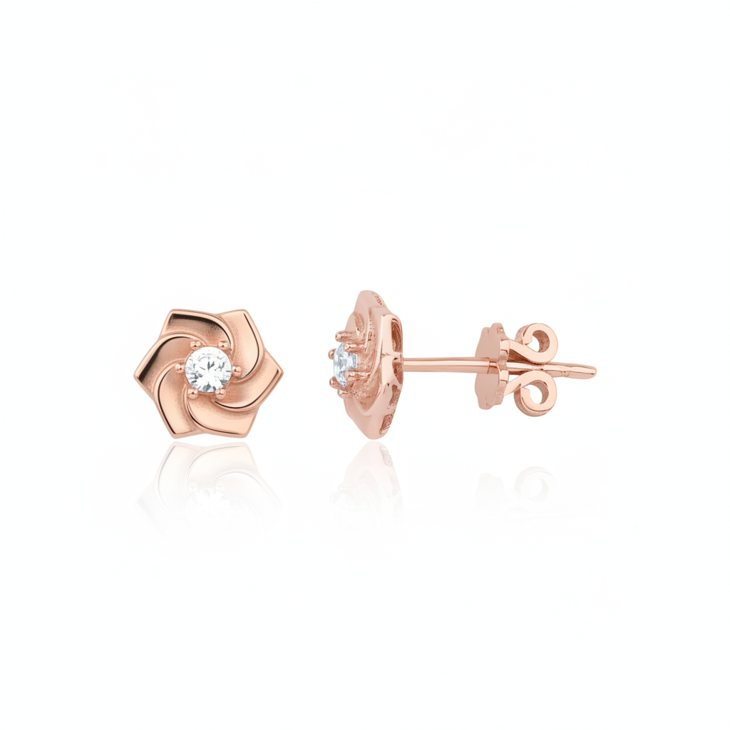 rose gold pinwheel petal stud earrings with a single clear stone on white background