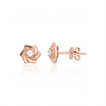 rose gold pinwheel petal stud earrings with a single clear stone on white background