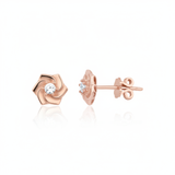 rose gold pinwheel petal stud earrings with a single clear stone on white background
