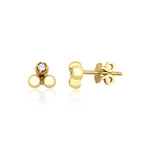 yellow gold triple sphere stud earrings with a single clear stone on white background