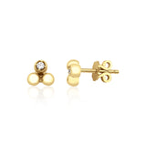 yellow gold triple sphere stud earrings with a single clear stone on white background