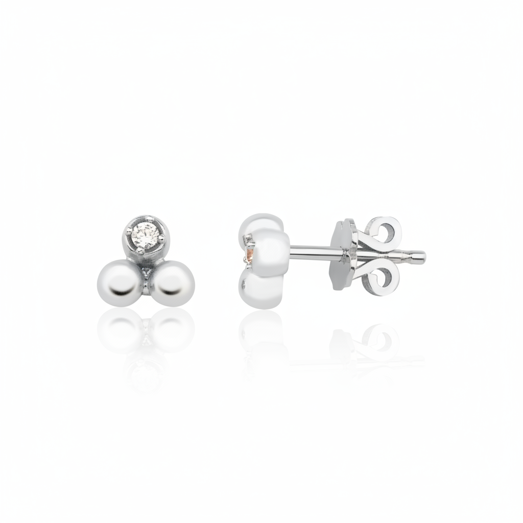 white gold triple sphere stud earrings with a single clear stone on white background