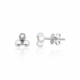 white gold triple sphere stud earrings with a single clear stone on white background