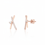 rose gold crossed bar stud earrings with clear stones on white background