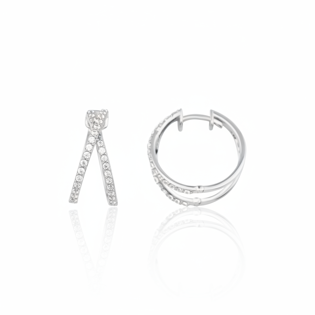 white gold criss-cross hoop earrings with clear stones on white background