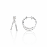 white gold criss-cross hoop earrings with clear stones on white background