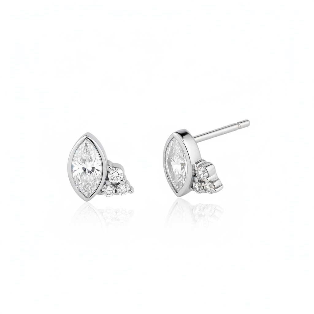 white gold marquise-cut stud earrings with a trio of clear stones on white background