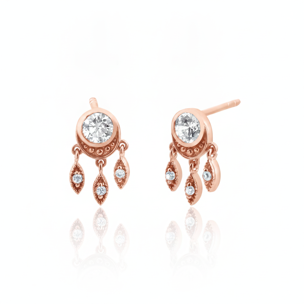 rose gold stud earrings with dangling leaf charms and clear stones on white background