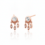rose gold stud earrings with dangling leaf charms and clear stones on white background