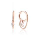 rose gold double hoop earrings with a dangling clear round stone on white background
