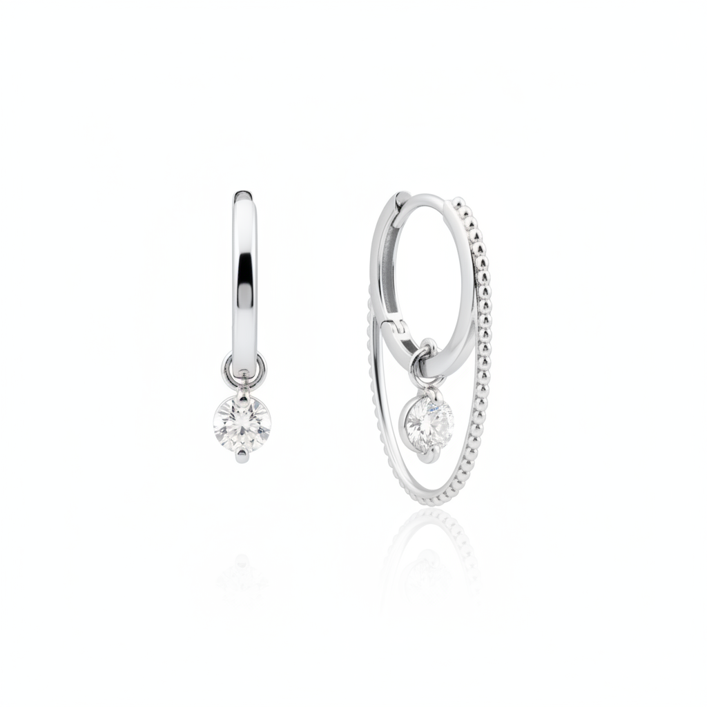 white gold double hoop earrings with a dangling clear round stone on white background