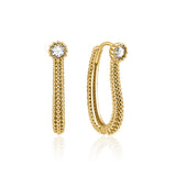 yellow gold beaded oval hoop earring with a White CZ stone on white background