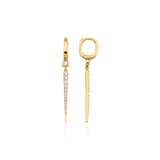 yellow gold huggie hoop earrings with a tapered pave spike drop on white background