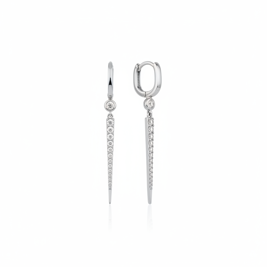 white gold huggie hoop earrings with a tapered pave spike drop on white background