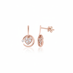rose gold circle drop earrings with a pave heart charm on white background