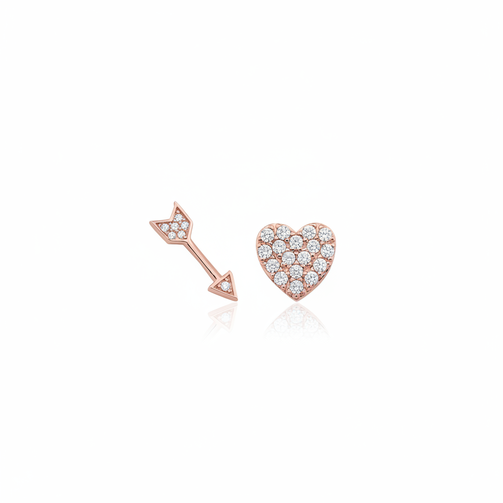 rose gold heart and arrow stud earrings on white background