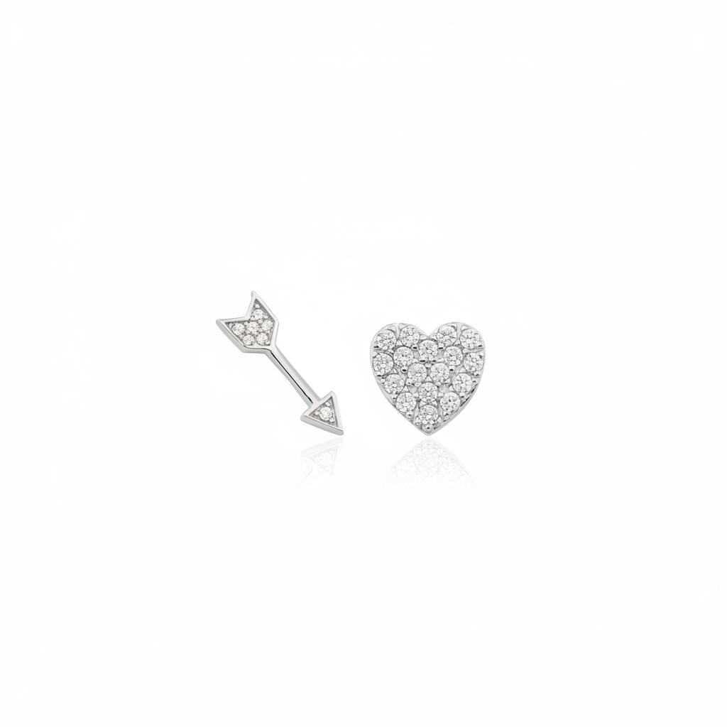 white gold heart and arrow stud earrings on white background