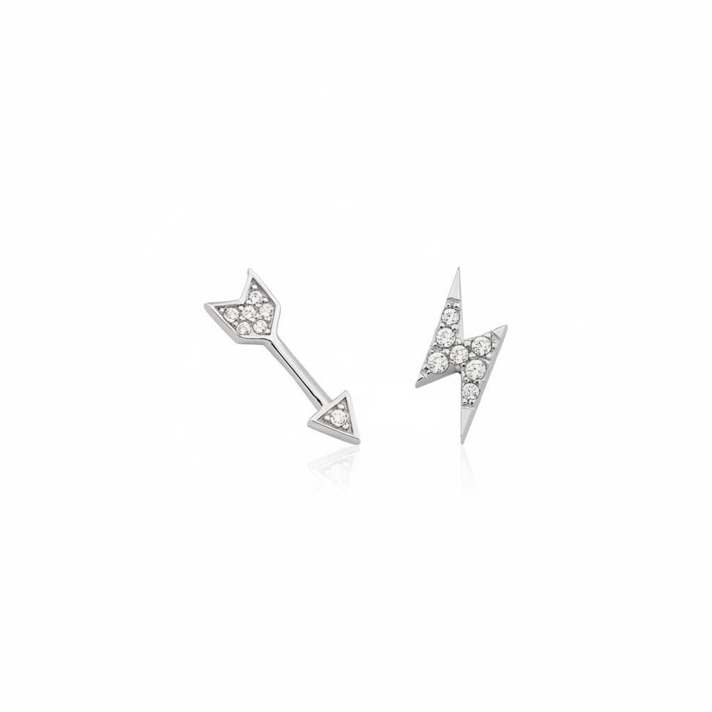 white gold arrow and lightning bolt stud earrings on white background