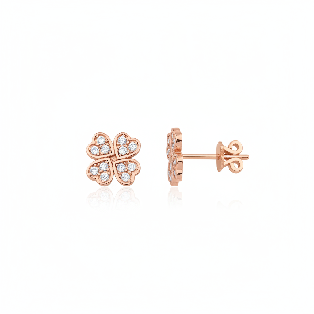 rose gold four-leaf clover stud earrings on white background