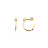 yellow gold open hoop earrings with bezel-set stone on white background
