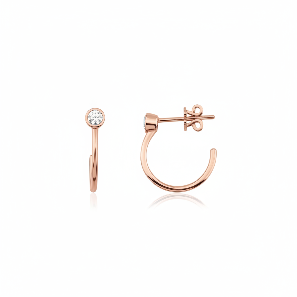 rose gold open hoop earrings with bezel-set stone on white background