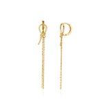 yellow gold knot huggie hoop earrings with drop chains on white background